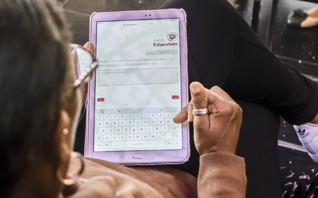 clinician-using-tablet-completing-online-patient-assessment-tool_450x280
